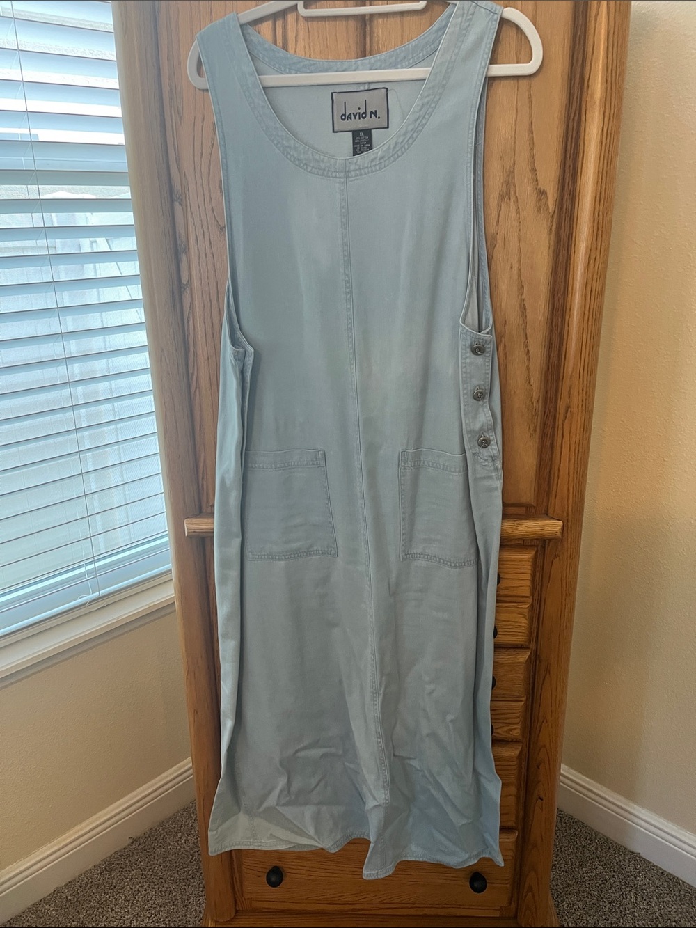 Women’s Light Blue Denim Jumper. Two front Pockets, buttons on side, slit on bac